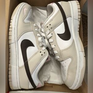 WORN ONCE Nike Cream and White Sneakers with Black Swoosh and Pink accent.